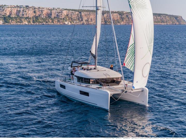 Cruise the beautiful turquoise waters of Tonnarella, Italy aboard this catamaran for rent.