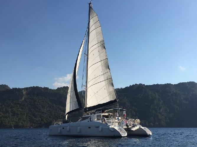 Explore the amazing Fethiye, Turkey on a catamaran - rent the 39ft Vamos boat and discover sailing.