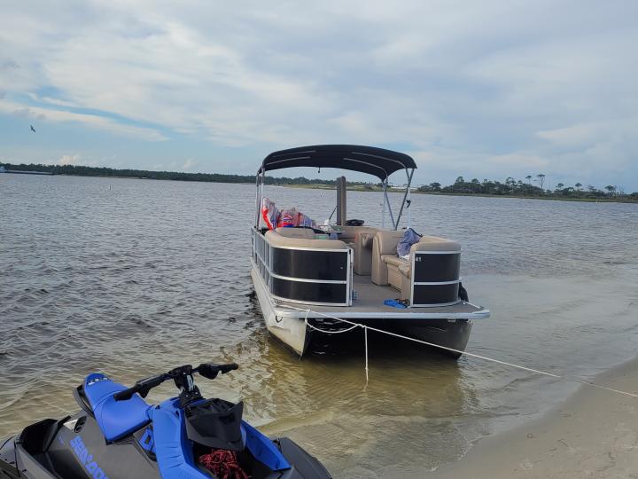 24ft pontoon with lights, Bluetooth radio, pole holders, add-on towables, mat, wakeboard, poles, cooler