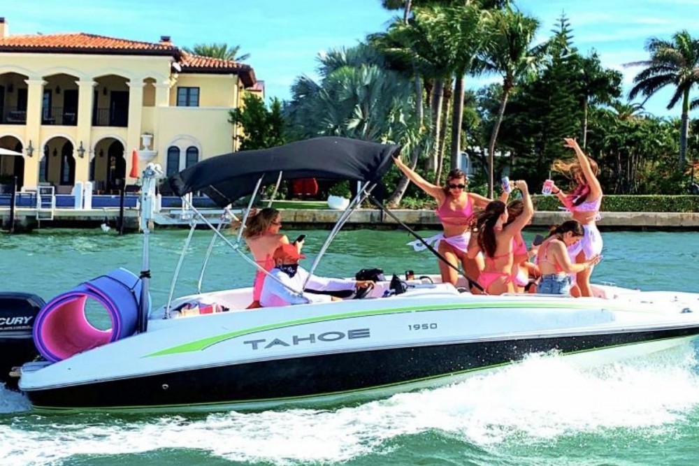Girls dancing on a boat while at a bachelorette party in Miami Beach