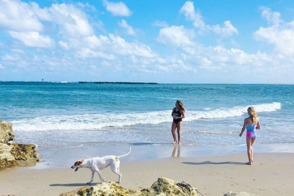 kids playing on the beach at St. Lucie Inlet