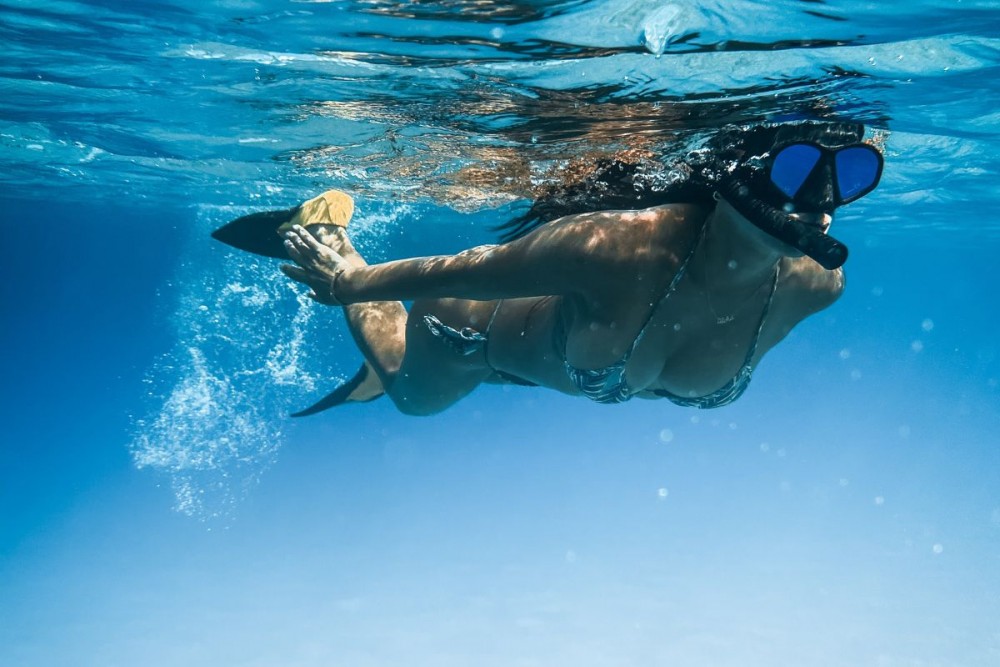 a woman snorkeling